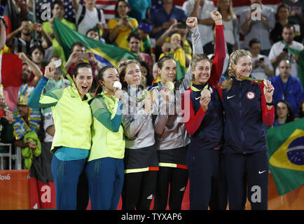 Silver medalists Agatha Bednarczuk Rippel and Barbara Seixas de Freitas of Brazil, gold medalists Laura Ludwig and Kira Walkenhorst of Germany and bronze medalists Kerri Walsh Jennings and April Ross of the United States stand on the podium during the medal ceremony for the Women's Beach Volleybal at the Beach Volleyball Arena at the 2016 Rio Summer Olympics in Rio de Janeiro, Brazil, on August 17, 2016.      Photo by Matthew Healey/UPI Stock Photo