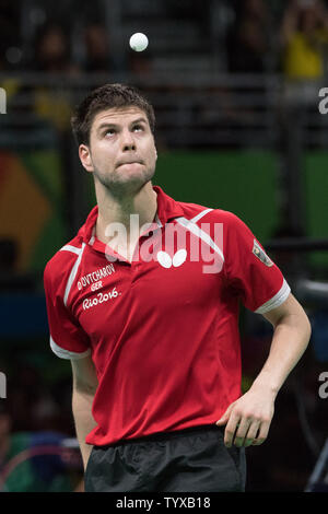 Dimitrij Ovtcharov of Germany bounces the ball off his head after defeating Saehyuk Joo of South Korea during the Men's Team Table Tennis bronze medal match in Riocentro Pavilion 3 at the 2016 Rio Summer Olympics in Rio de Janeiro, Brazil, on August 1, 2016.      Photo by Richard Ellis/UPI Stock Photo