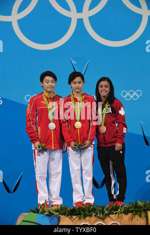 Gold medalist Ren Qian, center, silver medalist Si Yajie both of China and Meaghan Benfeito of Canada stand after receiving their medals during the award ceremony in the Women's 10m Platform Diving Final in Maria Lenk Aquatics Centre at the 2016 Rio Summer Olympics in Rio de Janeiro, Brazil, on August 18, 2016.      Photo by Richard Ellis/UPI Stock Photo