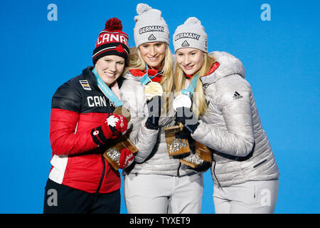 From left Women's Singles Luge bronze medalist Alex Gough of Canada, gold medalist Natalie Geisenberger of Germany and silver medalist Dajana Eitberger of Germany pose for a photo on the podium at the medals ceremony for the 2018 Pyeongchang Winter Olympics at the Pyeongchang Medals Plaza in Pyeongchang, South Korea, on February 14, 2018. Photo by Matthew Healey/UPI Stock Photo