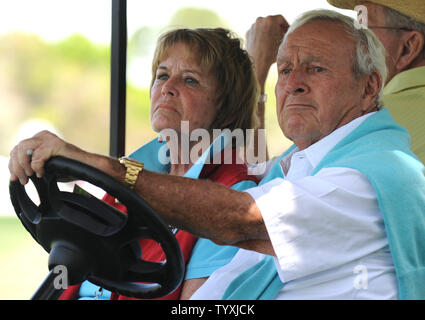 Arnold Palmer and his wife Kathleen Gawthrop ride in a golf cart during the third round of the Arnold Palmer Invitational at the Bay Hill Club and Lodge in Orlando, Florida on March 27, 2010. UPI/Kevin Dietsch Stock Photo