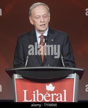 Former Liberal prime minister Jean Chretien talks to media as he ...