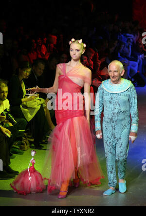 Models sport creations by British fashion designer John Models sport creations by British fashion designer John