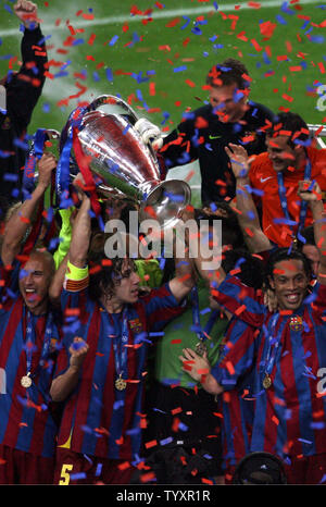 FC Barcelona hold the trophy at the end of their UEFA Champions