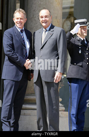 French President Jacques Chirac greets British Premier Tony Blair at the Elysee Palace in Paris, June 9, at the start of a Franco-British Summit. The two met to discuss Europe's energy supplies. (UPI Photo/Eco Clement) Stock Photo
