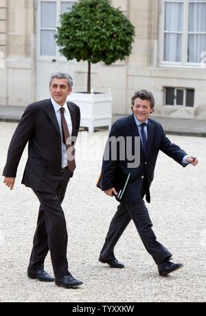 France's Defence Minister Herve Morin, left, and Jean Louis Borloo, economic strategy and employment minister, arrive at the Elysee Palace to attend the first weekly cabinet meeting of the newly named government in Paris on May 18, 2007. (UPI Photo/William Alix) Stock Photo