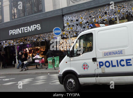 A police van seats in front of Le Printemps department store in Paris, on December 16, 2008, as business slowly goes back to normal following a bomb scare. Le Printemps was cordoned off and evacuated after a group calling itself the Afghan Revolutionary Front warned they had placed 'several bombs' in the store. (UPI Photo/Eco Clement) Stock Photo