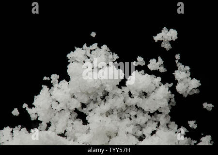 Macro of white crystal minerals isolated on black background Stock Photo