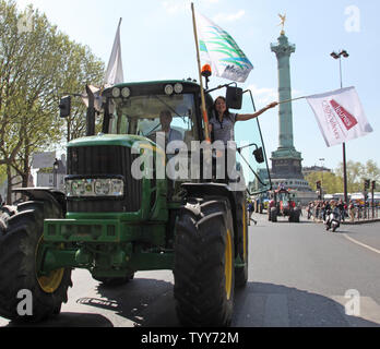 French grain farmers drive their tractors through the Place de la Bastille during a protest in Paris on April 27, 2010.  The demonstration, to protest falling revenues and to demand a return to increased EU regulation of their markets, brought Paris traffic to a halt throughout various parts of the city.   UPI/David Silpa Stock Photo