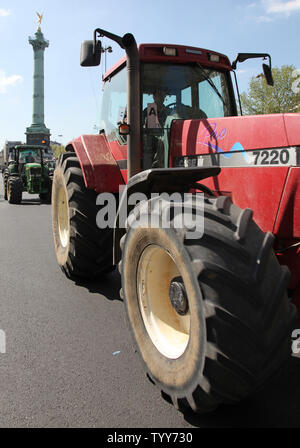 French grain farmers drive their tractors through the Place de la Bastille during a protest in Paris on April 27, 2010.  The demonstration, to protest falling revenues and to demand a return to increased EU regulation of their markets, brought Paris traffic to a halt throughout various parts of the city.   UPI/David Silpa Stock Photo