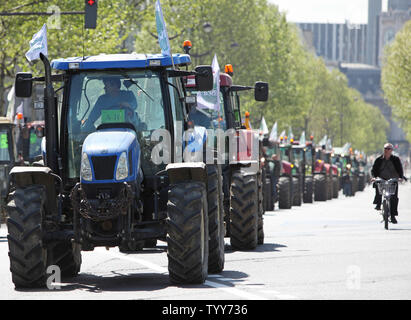 French grain farmers drive their tractors towards the Place de la Bastille during a protest in Paris on April 27, 2010.  The demonstration, to protest falling revenues and to demand a return to increased EU regulation of their markets, brought Paris traffic to a halt throughout various parts of the city.   UPI/David Silpa Stock Photo