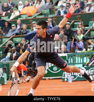 Serbian Novak Djokovic hits a shot during his French Open men's final match against Spaniard Rafael Nadal at Roland Garros in Paris on June 10, 2012.   UPI/David Silpa Stock Photo