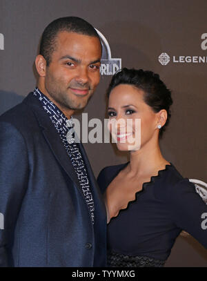 Tony Parker (L) and Axelle Francine arrive at the world premiere of the film 'Jurassic World' in Paris on May 29, 2014.   Photo by David Silpa/UPI. Stock Photo