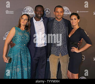 (From L to R) Helene Sy, Omar Sy, Tony Parker and Axelle Francine arrive at the world premiere of the film 'Jurassic World' in Paris on May 29, 2014.   Photo by David Silpa/UPI Stock Photo