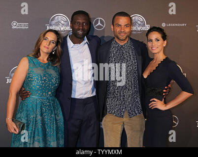 (From L to R) Helene Sy, Omar Sy, Tony Parker and Axelle Francine arrive at the world premiere of the film 'Jurassic World' in Paris on May 29, 2014.   Photo by David Silpa/UPI. Stock Photo