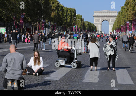 Parisians gather along the Avenue des Champs-Elysees during the 'Day Without Cars' in Paris on September 27, 2015.  The event, planned in conjunction with the global summit on climate change later this year, highlighted the need for European capitals to reduce air pollution.   Photo by David Silpa/UPI Stock Photo