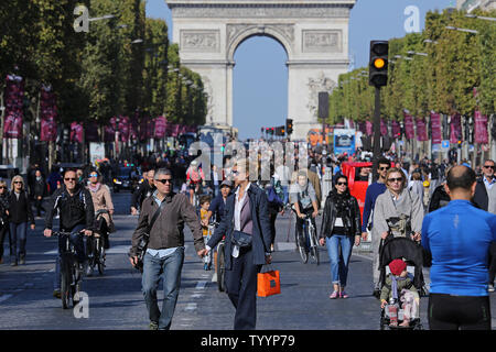 Parisians gather along the Avenue des Champs-Elysees during the 'Day Without Cars' in Paris on September 27, 2015.  The event, planned in conjunction with the global summit on climate change later this year, highlighted the need for European capitals to reduce air pollution.   Photo by David Silpa/UPI Stock Photo