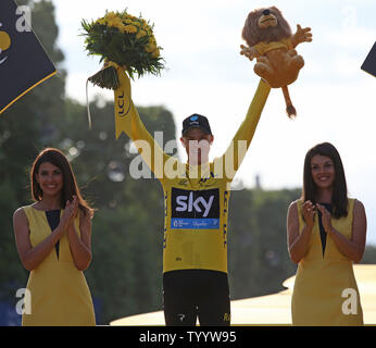 Chris Froome of Great Britain celebrates on the presentation podium after winning the Tour de France in Paris on July 24, 2016.  Froome claimed his third Tour de France victory.   Photo by David Silpa/UPI Stock Photo