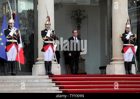 France's outgoing president Francois Hollande waits on the steps of the Elysee Palace for the arrival of newly elected president Emmanuel Macron in Paris on 14 May 2017. Macron was inaugurated today after a handover ceremony with Hollande. Photo by Maya Vidon-White/UPI Stock Photo