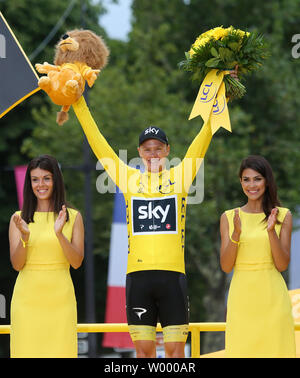 Chris Froome of Great Britain celebrates on the presentation podium after winning the Tour de France in Paris on July 23, 2017. Froome claimed his fourth Tour de France victory.   Photo by David Silpa/UPI Stock Photo
