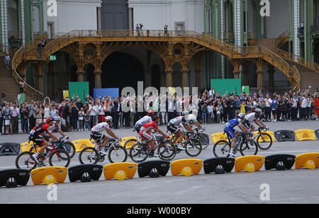 Competitors ride through the Grand Palais during the final stage of the Tour de France in Paris on July 23, 2017. Chris Froome of Great Britain claimed his fourth Tour de France victory.   Photo by David Silpa/UPI Stock Photo