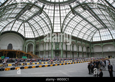 Competitors ride through the Grand Palais during the final stage of the Tour de France in Paris on July 23, 2017. Chris Froome of Great Britain claimed his fourth Tour de France victory.   Photo by David Silpa/UPI Stock Photo