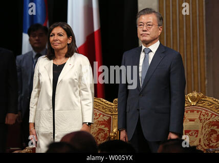 South Korean President Moon Jae-in (R), flanked by Paris Mayor Anne Hidalgo, attends an official welcome ceremony at City Hall in Paris on October 16, 2018. The South Korean president is in Paris on a four-day official state visit.   Photo by David Silpa/UPI Stock Photo