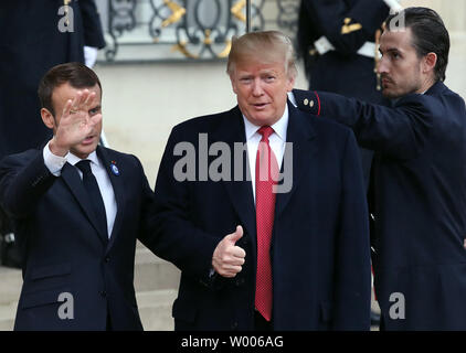 French President Emmanuel Macron greets his U.S. counterpart Donald Trump (R) on the steps of the Elysee Palace in Paris, November 10, 2018. Trump is in France to attend ceremonies marking the 100th anniversary of WWI Armistice Day.  Photo by Eco Clement/UPI Stock Photo