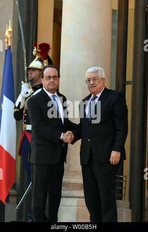 Palestinian President Mahmoud Abbas (Abu Mazen) shakes hands with French President Francois Hollande in Paris on July 21, 2016.     Photo by Thaer Ghanaim Stock Photo