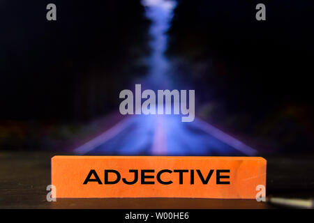 Adjective on the sticky notes with bokeh background Stock Photo