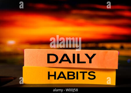 Daily Habits on the sticky notes with bokeh background Stock Photo