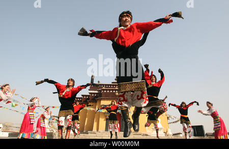 Chinese performers, on hire, work at a replica of an Altar Temple in Lhasa, Tibet which represents one part of the 56 ethnic groups showcased by Han Chinese in Beijing's China Nationalities Museum, or Chinese Ethnic Cultural Park, March 15, 2009. China accused the U.S. Congress last week of damaging relations and meddling in China's internal affairs by passing a resolution recognizing the plight of Tibet's people and their exiled spiritual leader, the Dalai Lama. (UPI Photo/Stephen Shaver) Stock Photo