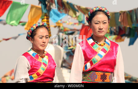 Chinese performers, on hire, work at a replica of an Altar Temple in Lhasa, Tibet which represents one part of the 56 ethnic groups showcased by Han Chinese in Beijing's China Nationalities Museum, or Chinese Ethnic Cultural Park, March 15, 2009. China accused the U.S. Congress last week of damaging relations and meddling in China's internal affairs by passing a resolution recognizing the plight of Tibet's people and their exiled spiritual leader, the Dalai Lama. (UPI Photo/Stephen Shaver) Stock Photo