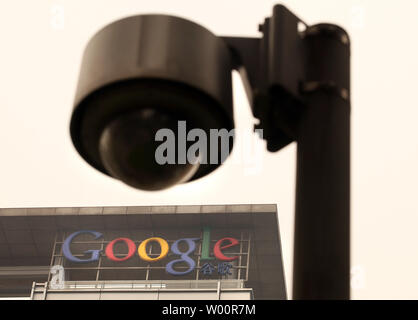 A closed circuit television surveillance camera stands in front of