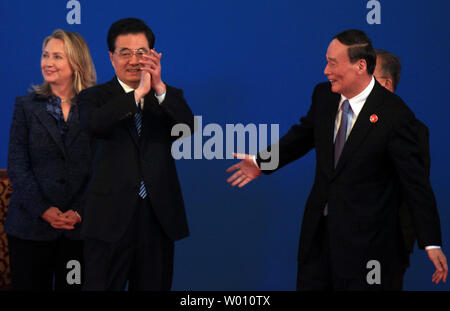U.S. Secretary of State Hillary Clinton (L) stands next to Chinese President Hu Jintao (C) as Chinese Vice Premier Wang Qishan walks towards them after the opening ceremony of the U.S.-China Strategic and Economic Dialogue in Beijing on May 3, 2012.  China and the United States need to learn how to trust each other, Chinese President Hu Jintao said at the start of the annual talks.     UPI/Stephen Shaver Stock Photo