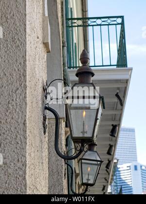 Gas Lamps Adorn the exterior of an old building in New Orleans, Louisiana, USA Stock Photo