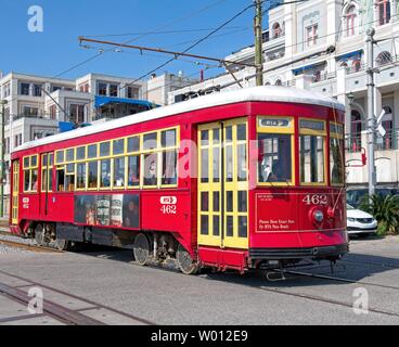 A red street car with yellow doors on the streets of New Orleans Stock Photo