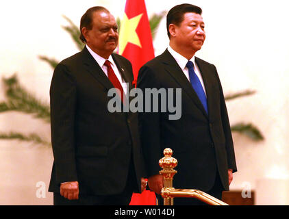 Pakistani President Mamnoon Hussain (L) and Chinese President Xi Jinping attend a welcoming ceremony at the Great Hall of the People in Beijing on February 19, 2014.  Longtime allies China and Pakistan signed bilateral agreements to build a new airport  and upgrade a major highway between the two countries as part of efforts to build an 'economic corridor' through mountains and a region prone to insurgent violence.       UPI/Stephen Shaver Stock Photo