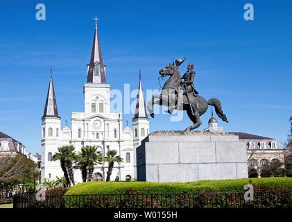 A statue of Andrew Jackson sits in Andrews Square in New Orleans.  St. Louis Cathedral can be seen in the background. Stock Photo