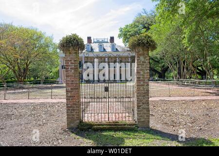 Entrance gate between two brick columns outside the historic Oak Alley Plantation Stock Photo