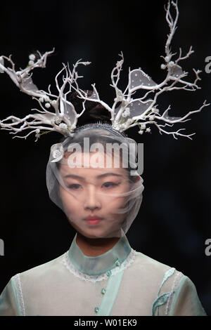 Models wear clothing by designer Xiong Ying during the annual China Fashion Week in Beijing on April 1, 2018.  An increasing number of Chinese fashion designers are gaining international recognition for their creativity and modernism.    Photo by Stephen Shaver/UPI Stock Photo