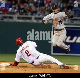 Houston Astros shortstop Adam Everett (28) goes high to avoid the slide of Philadelphia Phillies Ron Barajas (2) during a fifth inning double play at Citizens Bank Park in Philadelphia, April 13, 2007.   (UPI Photo/John Anderson) Stock Photo