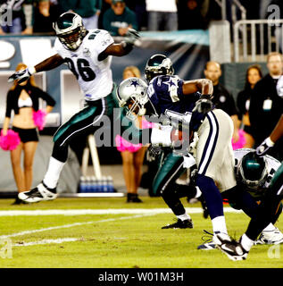 Seattle Seahawks wide receiver Nate Burleson (81) dodges as he runs for a  12-yard gain and a touchdown during first quarter play at Philadelphia's  Lincoln Field December 2, 2007.Chasing him is Philadelphia