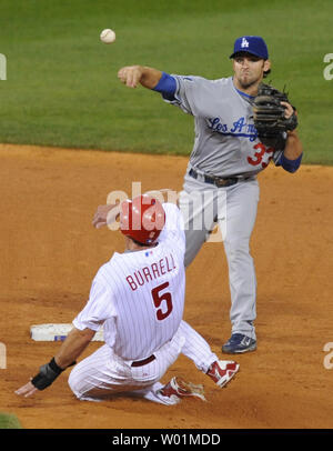 Los Angeles Dodgers Jason Werth, center, is congratulated by teammates  after scoring on a two-run single by teammate Paul Lo Duca in the seventh  inning against the Anaheim Angels in Anaheim, Calif.