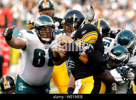 Philadelphia Eagles Juqua Parker (75) tries to drag down New York