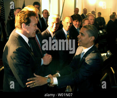 President-elect Barack Obama (R) greets Gov. Arnold Schwarzenegger (R-CA) prior to a National Governors Association meeting at Congress Hall in Philadelphia on December 2, 2008. The group met to talk about the ongoing economic crisis. (UPI Photo/Kevin Dietsch) Stock Photo