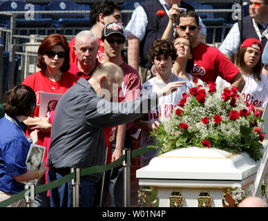 One of the thousands of  fans who came to Citizens Bank Park April 18, 2009 to pay their respects to longtime Hall of Famer Philadelphia Phillies announcer Harry Kalas was a blind fan, helped by park personel (far left).  Kalas,  a Philadelphia Phillies announcer for the past 30 years, died earlier this week at a game.  He is only the second baseball person to lie in state in a professional baseball stadium since Babe Ruth in 1948.   (UPI Photo/John Anderson) Stock Photo