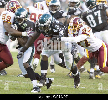 Washington Redskins' full back John Riggins (44) is slowed down near the  Dallas goal line by Cowboys cornerback Benny Barnes, left, and linebacker  Bob Breunig (53) during the frist quarter of game