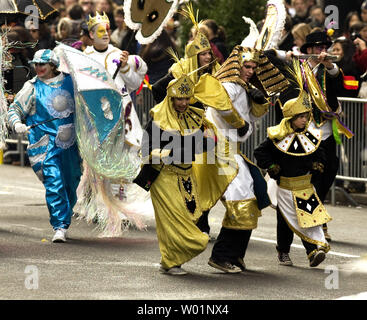 Mummers, dressed in Mid-Eastern robes dance up Broad Street in downtown Philadelphia January 1, 2010. Thousands dress up in comic costumes and feathered outfits to participate in the parade that has been a Philadelphia tradition for 110 years.     UPI/John Anderson Stock Photo