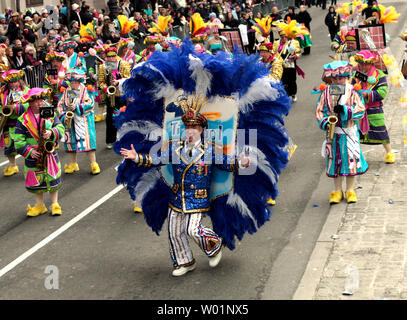 A member of the Durning String Band division of the the Mummers struts up Broad Street with his band in downtown Philadelphia January 1, 2010. Thousands dress up in comic costumes and feathered outfits to participate in the parade that has been a Philadelphia tradition for 110 years.     UPI/John Anderson Stock Photo